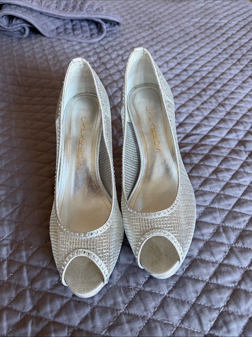 Caparros Mesh and Glitter-Encrusted Trim with Peep Toe and Tapered Heel.